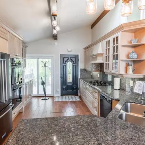 Fully equipped chef’s kitchen with granite countertops, stainless steel appliances, and everything you need to cook at home.