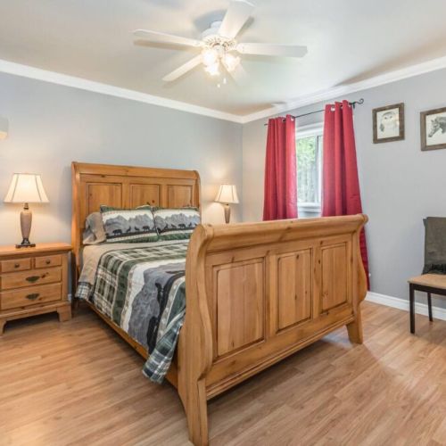 This guest room features a stunning sleigh bed and a comfortable Queen sized mattress. All linens and towels are supplied.