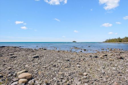 Spend your days exploring the property's natural rocky shoreline and enjoy the peaceful beauty of Lake Huron right at your doorstep.