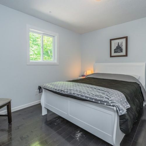 The upper floor queen suite with closet space.