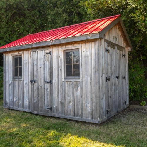 Rustic on site storage shed for extra gear and classic cottage character.