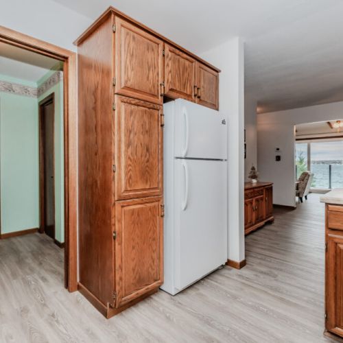 Convenient and functional kitchen space connects easily to living areas, creating a welcoming atmosphere for your cottage retreat.