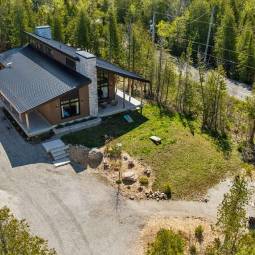 Aerial view of Cabin nestled among the trees in beautiful Beaver Valley.