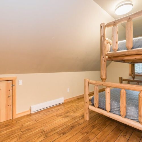 Double bed on the lower, single on the upper in the kids bunk room. Perfect for sharing stories into the night, the sturdy bunk beds are the quintessential space for family or friends.