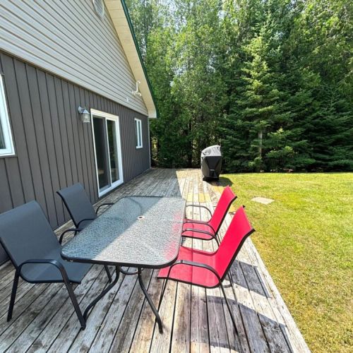 Fire up the grill and enjoy meals outdoors—this backyard patio is made for good food and great company.