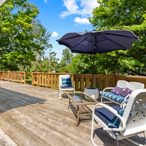 Relax on the spacious deck with comfortable outdoor seating and BBQ.