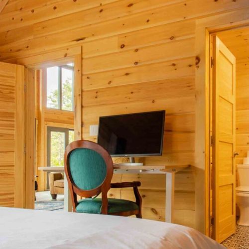 Work meets relaxation—master suite with private workspace and ensuite bathroom.