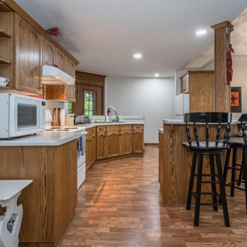 Pull up a chair and enjoy the eat-in kitchen island. The kitchen comes fully stocked with everything you could possibly need to enjoy yourself.