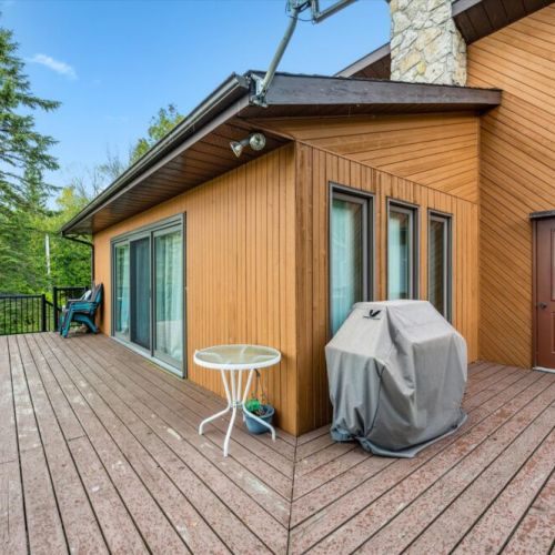 Take in the fresh air and unwind on the expansive upper deck with wraparound glass railing – perfect for BBQs, morning coffee, or evening sunsets.