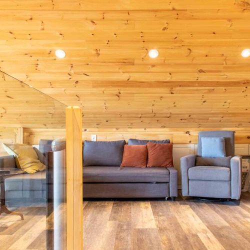 Relax upstairs—loft family room with smart TV and comfortable seating.