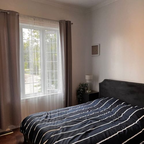 Cozy bedroom with queen bed, perfect for restful nights after a day outdoors