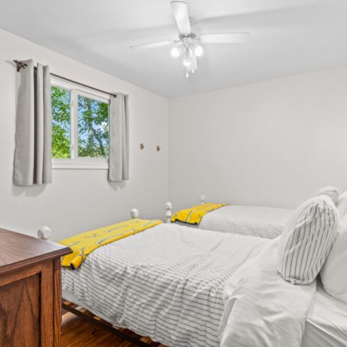 Wake up refreshed in a peaceful bedroom surrounded by nature.