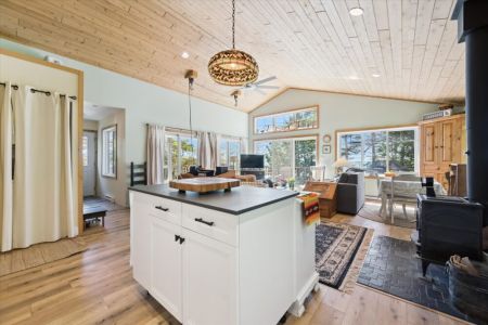 The open-concept design keeps everyone connected, whether you're cooking in the kitchen or relaxing in the living room.