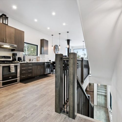 A sleek, modern kitchen with stainless appliances, generous prep space, and an open layout that keeps you connected to the rest of the home.