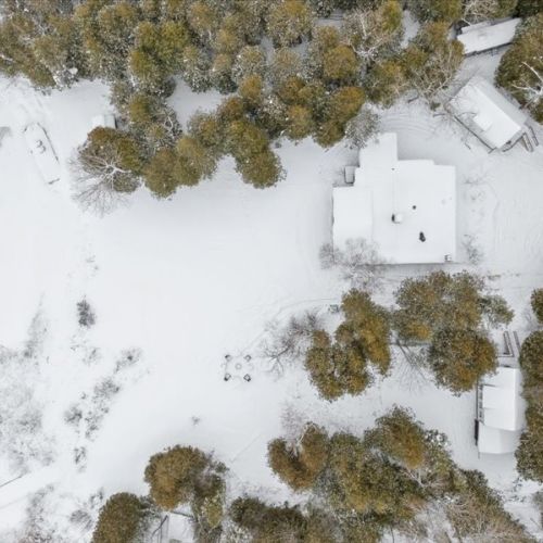 A private retreat tucked into the trees, surrounded by fresh snow and nature.