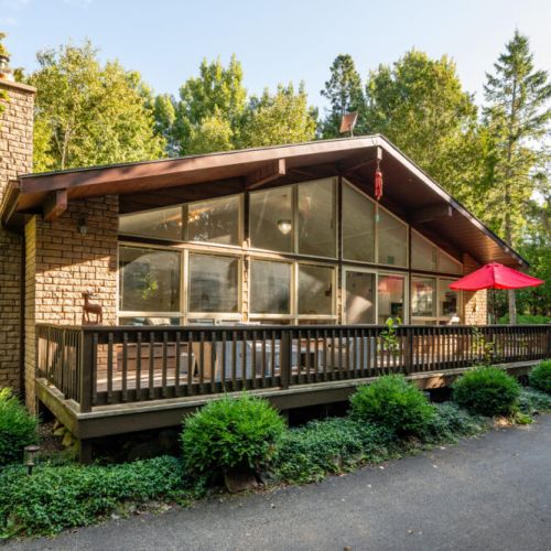 A very long and spacious front porch welcomes guests.