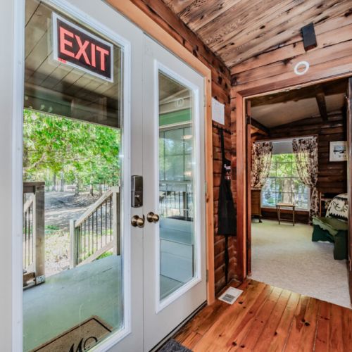 Escape to this cozy log cabin vacation rental nestled in the woods. Featuring rustic charm, private outdoor access, and family-friendly amenities—perfect for a peaceful getaway in nature. Ideal for weekend retreats or extended stays.
