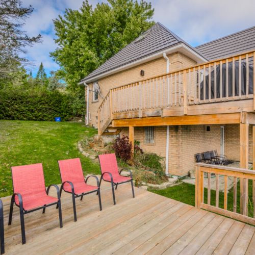 Backyard patio area with comfortable seating, perfect for relaxing and enjoying the surroundings.