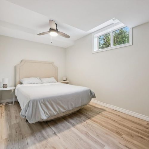 A quiet and comfortable bedroom retreat designed for restful cottage nights.