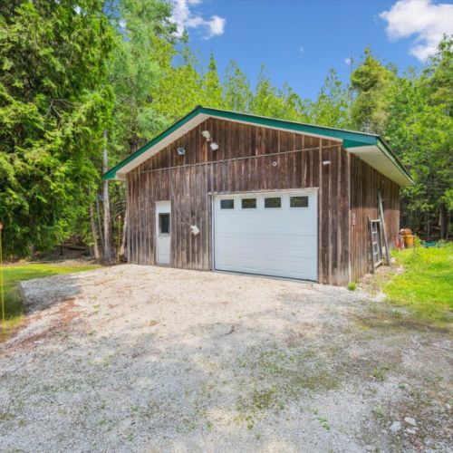 The detached garage offers handy storage for outdoor gear, bikes, or winter equipment.