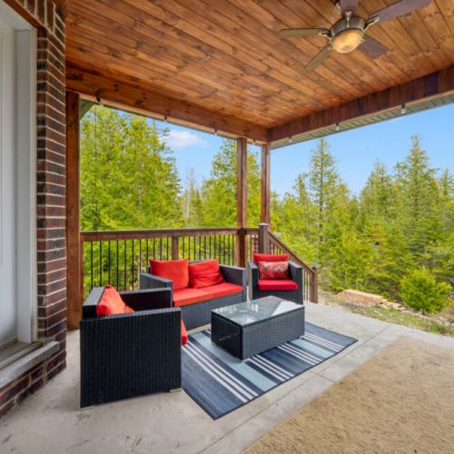 Unwind with your morning coffee or evening drink on the covered patio surrounded by peaceful forest views.