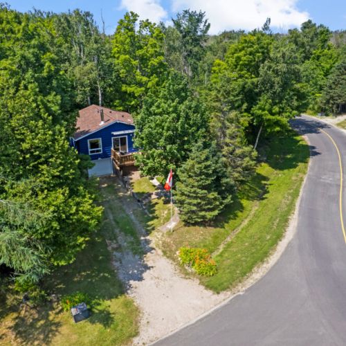 Nestled among the trees, True Blue Getaway offers privacy and easy lake access.