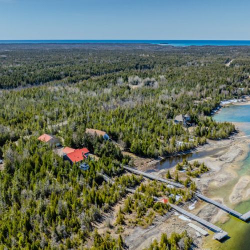 Rustic charm meets modern comfort in this inviting vacation rental. Relax by the stone fireplace, cook in the spacious kitchen, or unwind in the open-concept living area after a day on the lake.