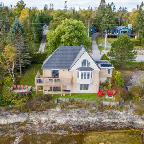 A beautiful Georgian Bay waterfront home nestled in a serene and family-friendly neighborhood. Surrounded by manicured gardens and natural beauty, this property offers easy access to hiking trails, kayaking, and the best of the Bruce Peninsula's outdoor adventures.
