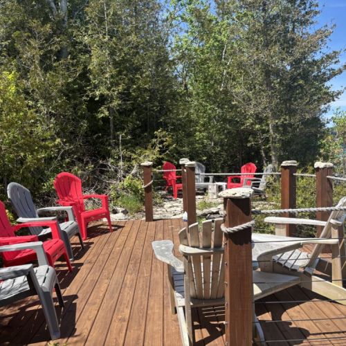 Engage in laughter and friendly competition on Beeshore's spacious deck, fully equipped with an array of seating to enjoy the scenic beauty and connect with loved ones.