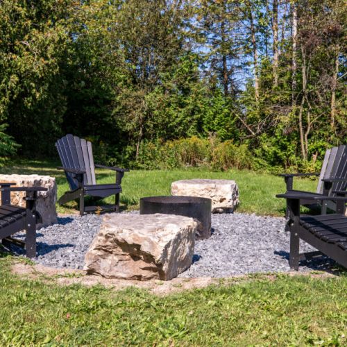 Adirondack fire pit lounge with plenty of seating for your whole group.