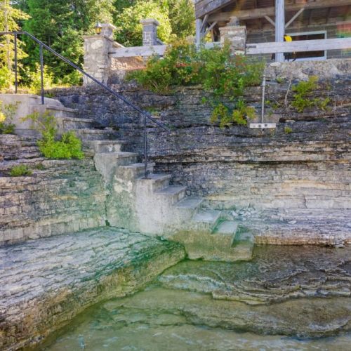 Follow the stone steps to the waters edge, perfect for swimming or taking in the sights of nature.