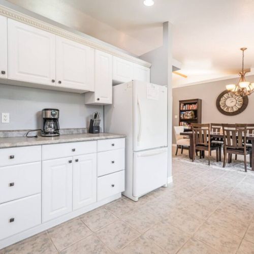 The kitchen opens into the elegant dining area.