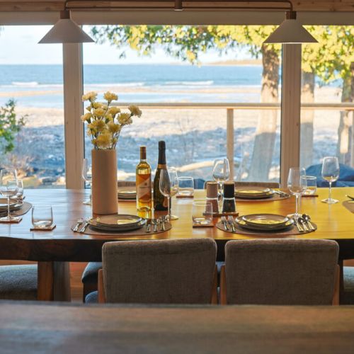 Imagine enjoying a delicious meal at this dining table, with breathtaking views of Lake Huron and the stunning North Bruce Peninsula as your backdrop. This is the perfect setting for creating unforgettable memories in Tobermory.