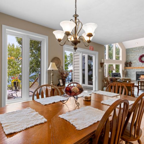 Gather around the dining table for meals together, with natural light and beautiful waterfront scenery just steps away.