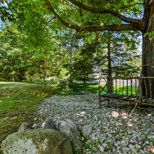 Find a quiet spot beneath the trees to relax and enjoy the peaceful surroundings.