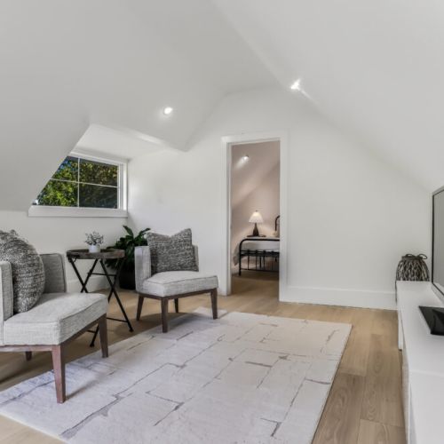 Bright loft living area with cozy seating and a quiet place to relax away from the main cottage.