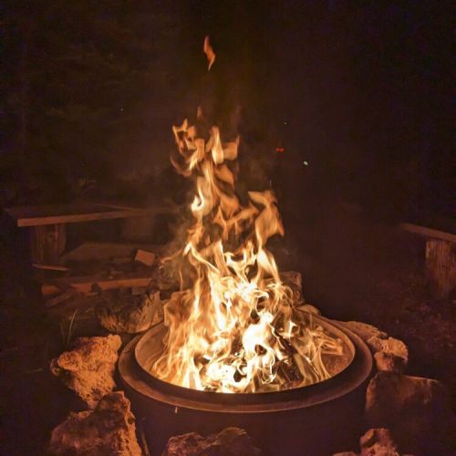 Unwind under the stars by a crackling fire pit—perfect for roasting marshmallows, sharing stories, and creating unforgettable cottage memories.