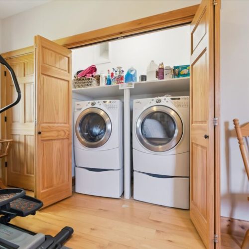 Convenient in-cottage laundry area with full-size washer and dryer.
