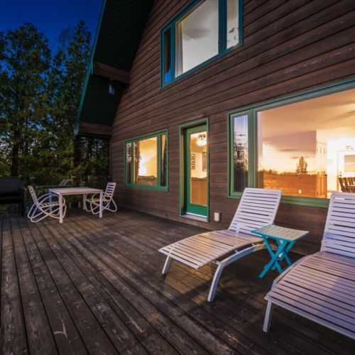 Spacious outdoor deck seating makes it easy to enjoy morning coffee or evening sunsets.