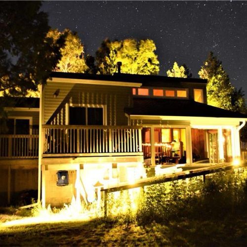 Cozy evenings at the cottage—beautifully lit for relaxing nights under the stars.