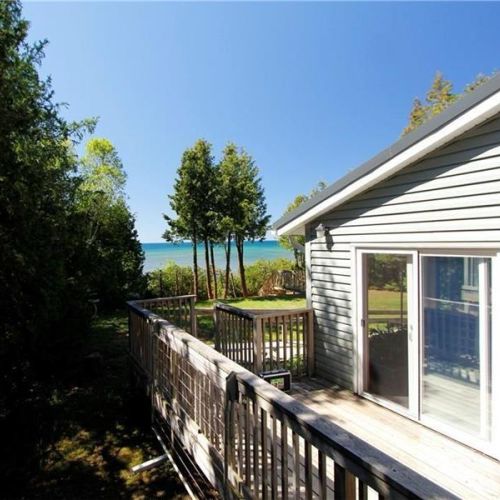 Private deck with peaceful views toward the lake—ideal for morning coffee or evening relaxation.