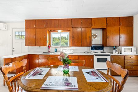 Enjoy the character of the original-style farmhouse kitchen and a dining area perfect for sharing meals together.