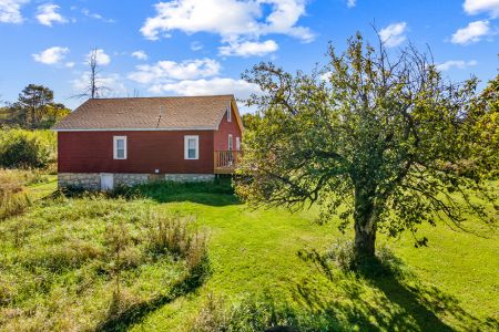 Mature apple trees add to the authentic country character and generations of history found throughout the property.