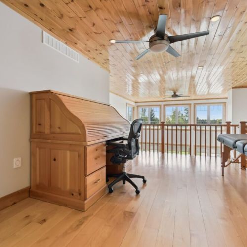 Spacious upper loft overlooking the great room with beautiful panoramic windows.