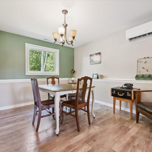 Bright dining space with seating for four, ideal for shared meals and morning coffee.