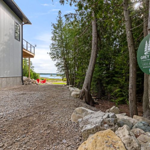 A short path leads from the driveway to your private waterfront getaway.