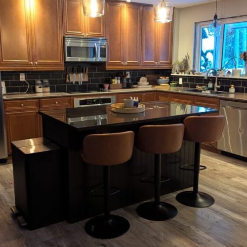 Spacious kitchen island with comfortable bar seating — perfect for casual meals, morning coffee, or gathering while cooking.