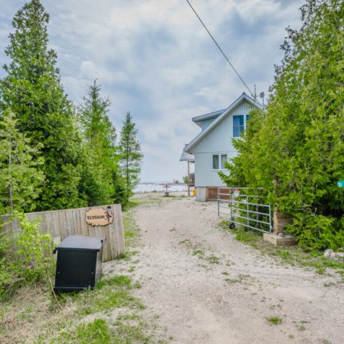 On approach to Elysium Cottage leading to the water, perfect for outdoor activities and enjoying the lakeside scenery.