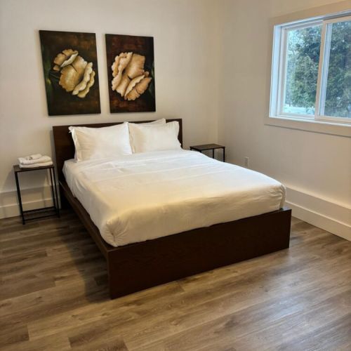 The lower level bedroom with outstanding views of the waterfront.