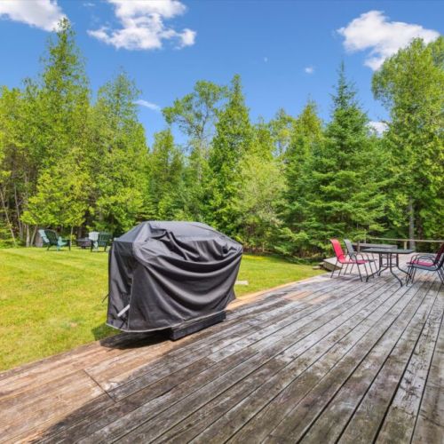 Gather for outdoor meals with a BBQ and patio seating, surrounded by greenery and fresh air.
